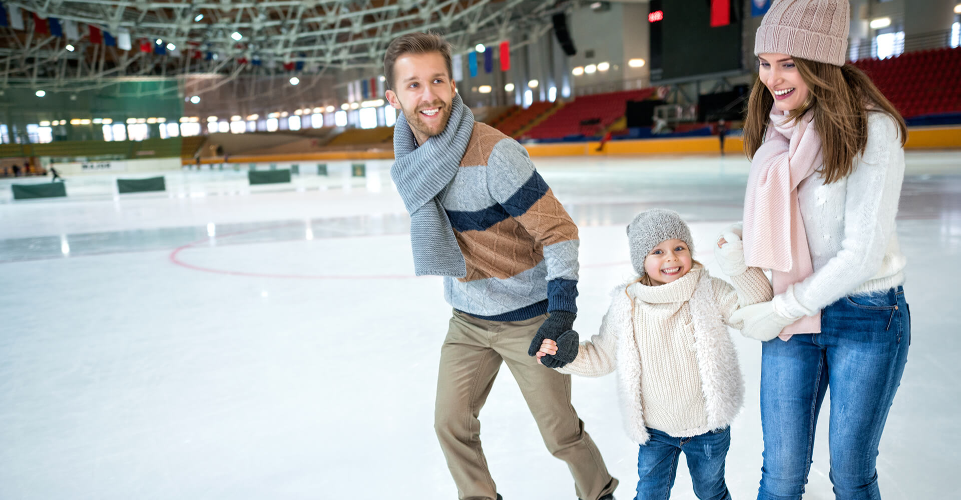 A Baby skating with her mom & dad